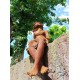 Garden sculpture of a sitting fairy - romantic garden design
